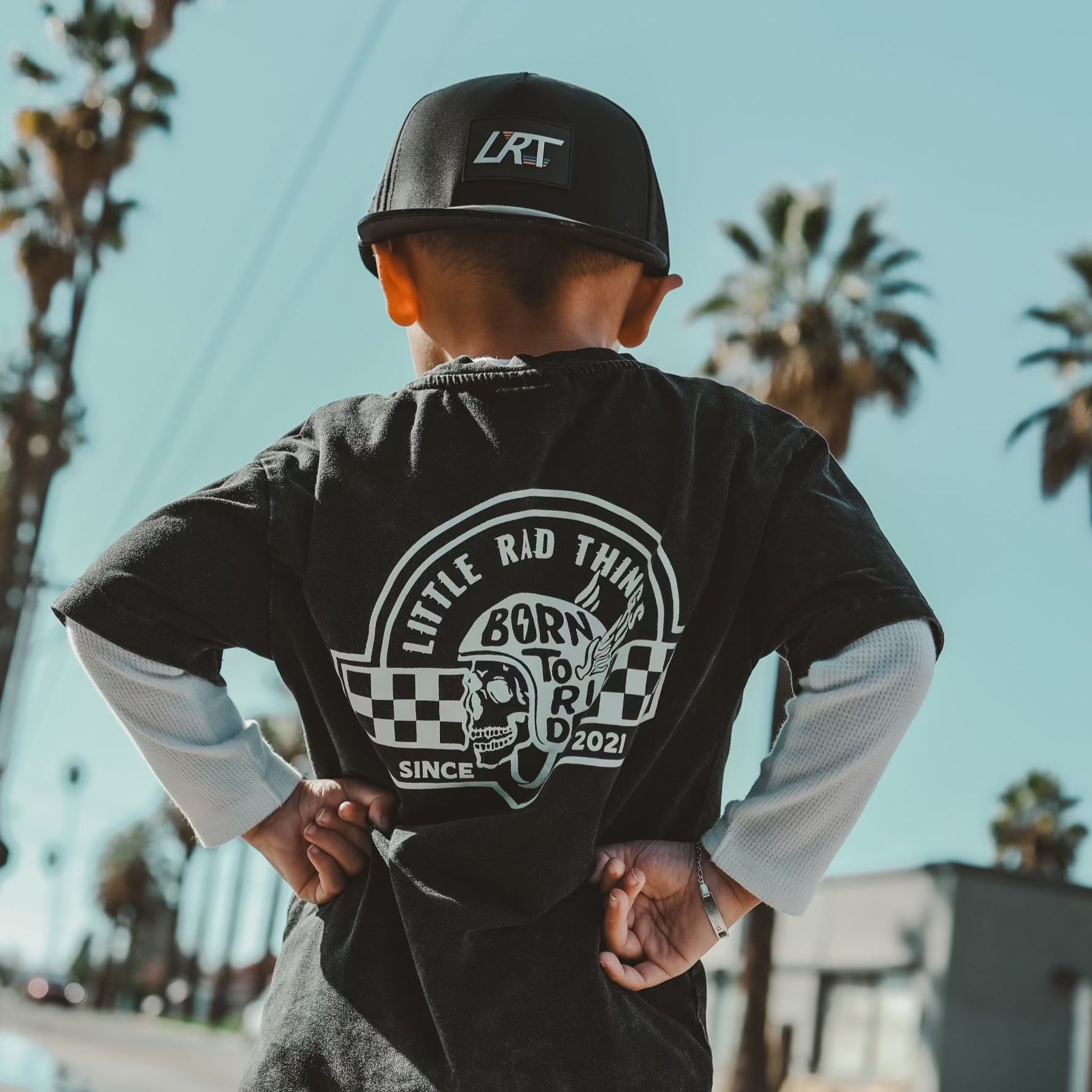 Little Rad Things toddler t-shirt featuring edgy 'Til Death Do We Ride' graphic, showcasing acid-wash texture and rebellious kid's fashion