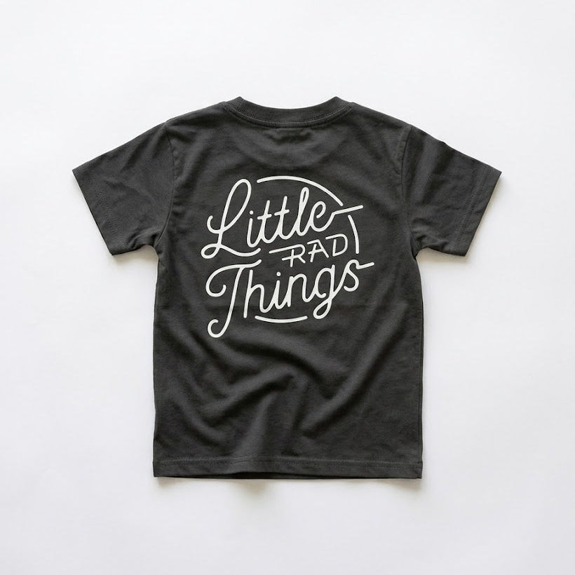 Black t-shirt with 'Little Rad Things' text on a white background
