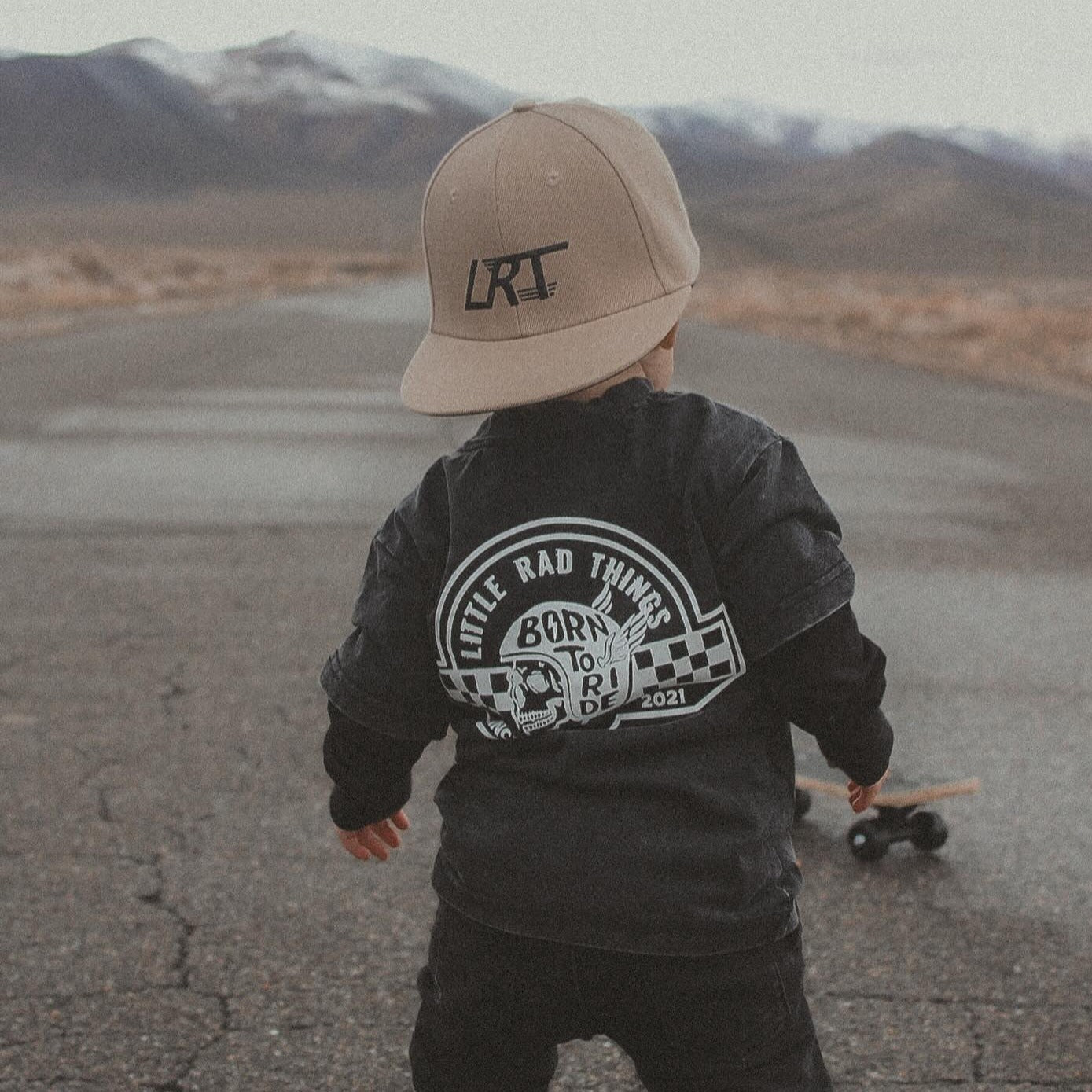 Little Rad Things toddler t-shirt featuring edgy 'Til Death Do We Ride' graphic, showcasing acid-wash texture and rebellious kid's fashion