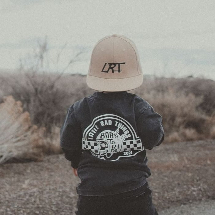 Little Rad Things toddler t-shirt featuring edgy 'Til Death Do We Ride' graphic, showcasing acid-wash texture and rebellious kid's fashion