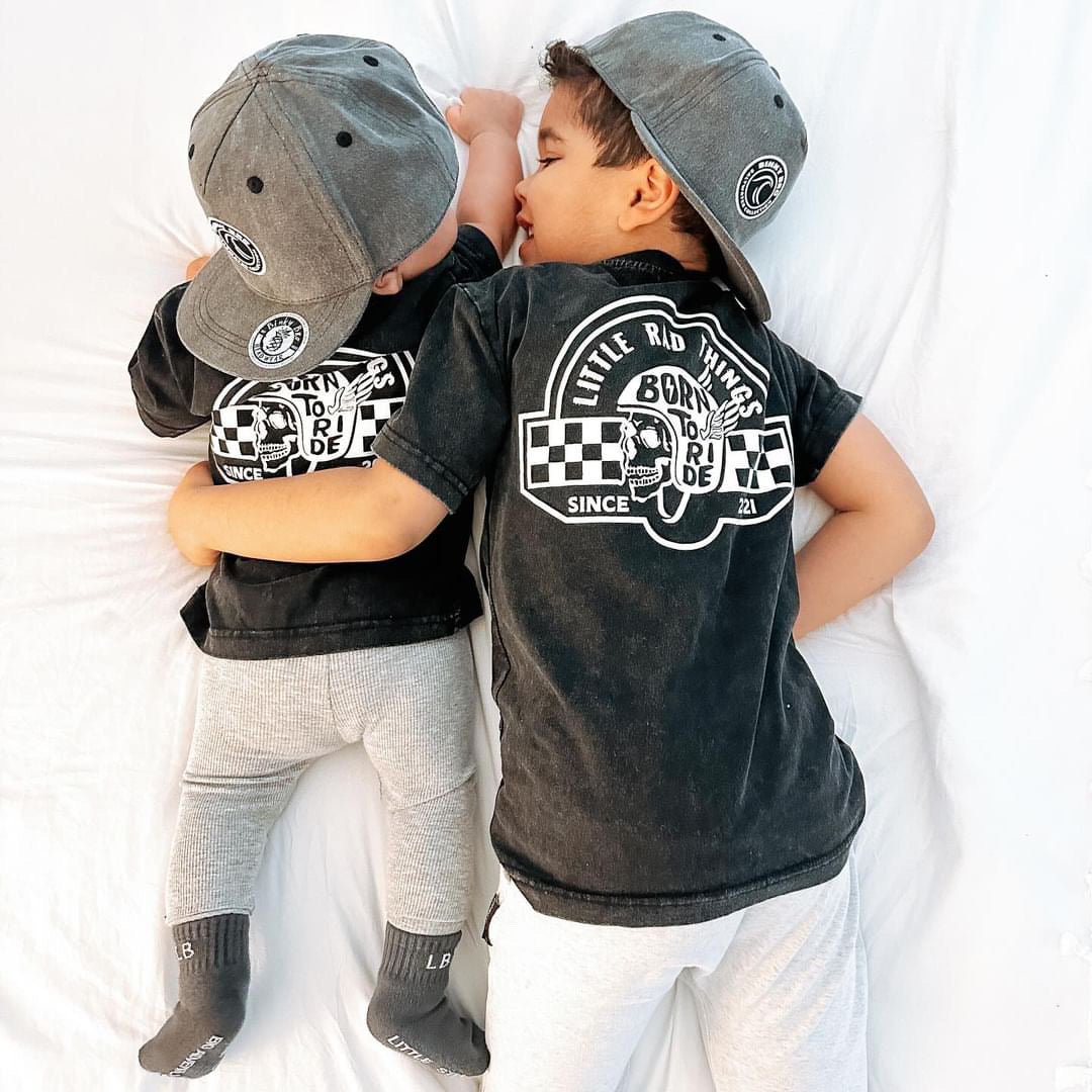 Little Rad Things toddler t-shirt featuring edgy 'Til Death Do We Ride' graphic, showcasing acid-wash texture and rebellious kid's fashion