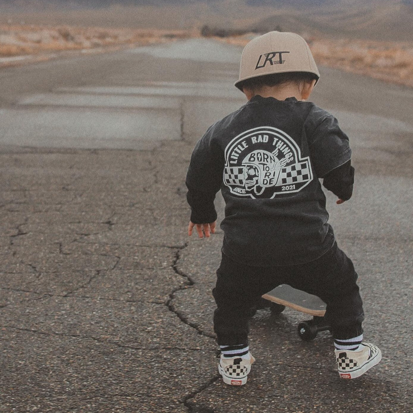 Little Rad Things toddler t-shirt featuring edgy 'Til Death Do We Ride' graphic, showcasing acid-wash texture and rebellious kid's fashion