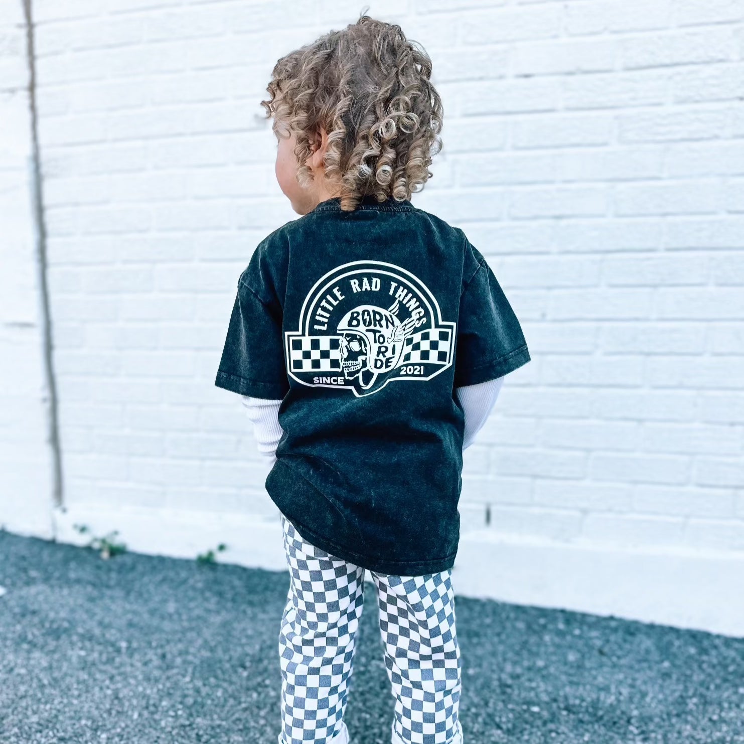Little Rad Things toddler t-shirt featuring edgy 'Til Death Do We Ride' graphic, showcasing acid-wash texture and rebellious kid's fashion