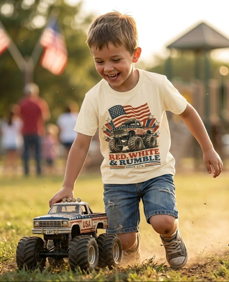 Child playing with a toy truck in a park with American flags in the background