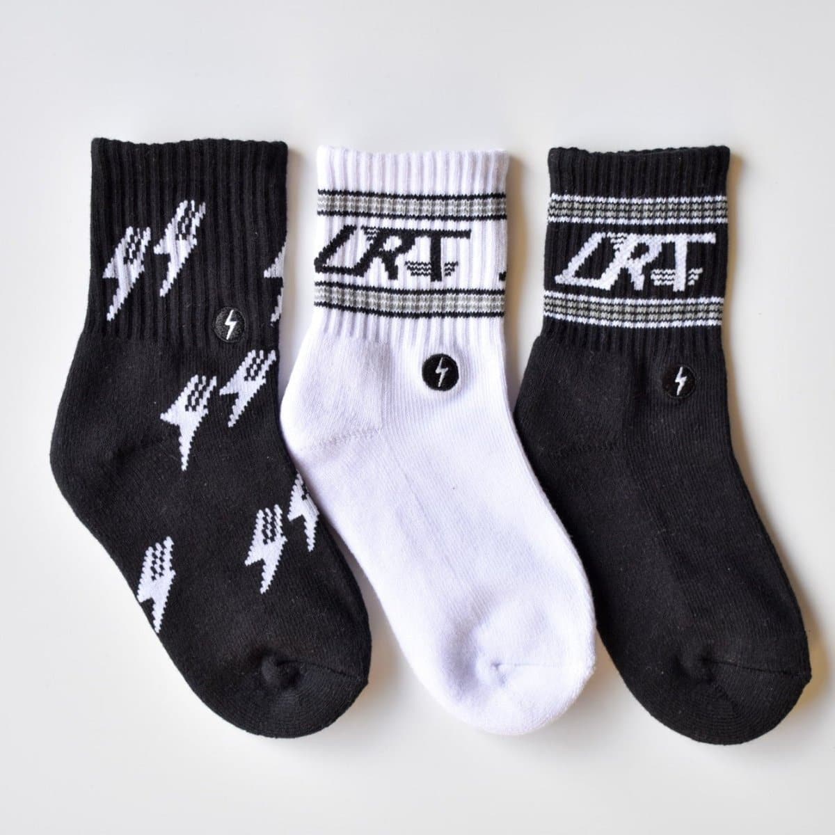 Kid's Classic Rock sock collection featuring LRT spark logo, showcasing premium cotton blend and cushioned comfort. Three-pack displayed to highlight vintage design details.
