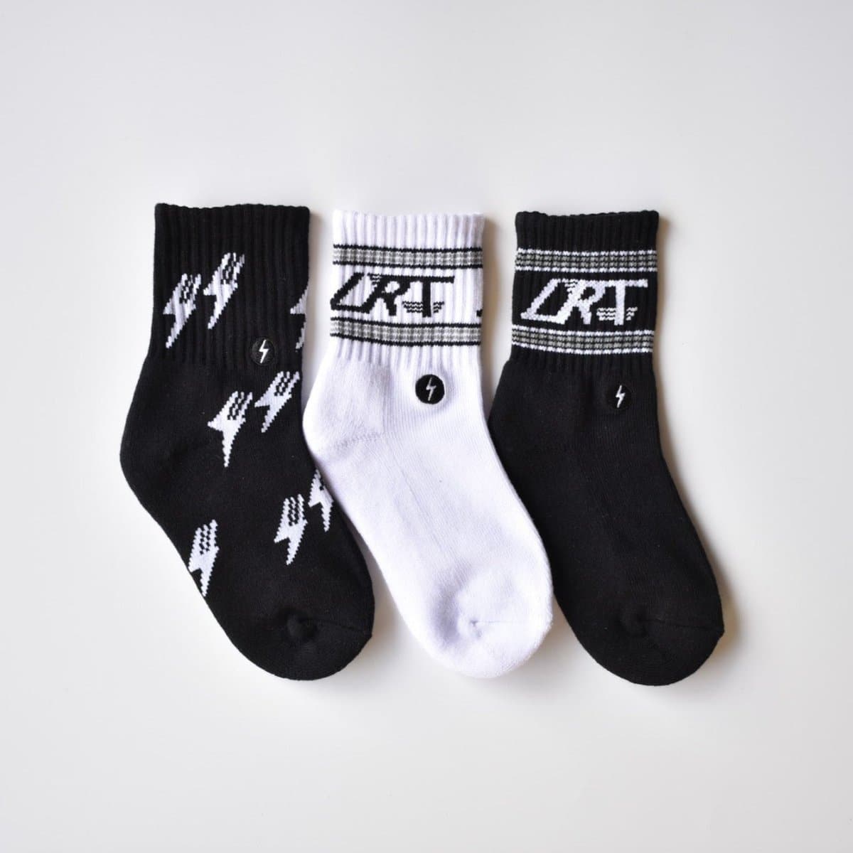 Kid's Classic Rock sock collection featuring LRT spark logo, showcasing premium cotton blend and cushioned comfort. Three-pack displayed to highlight vintage design details.