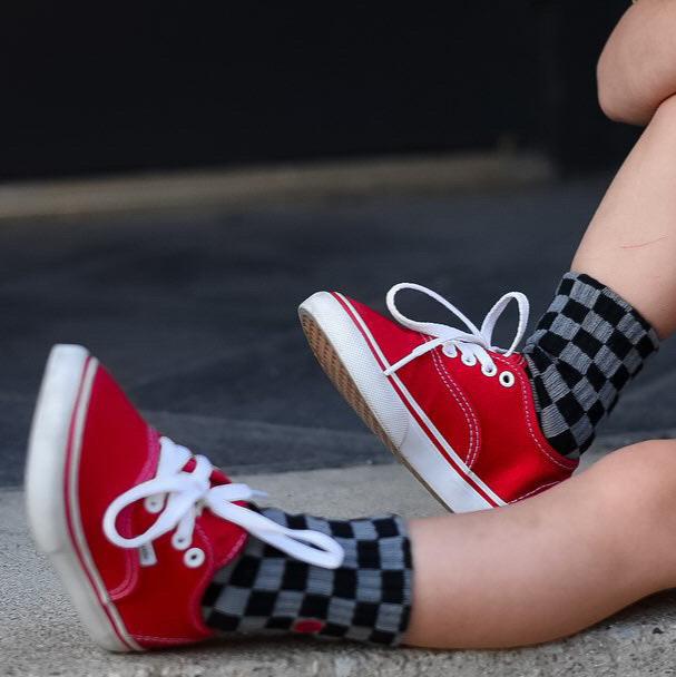 Premium kids socks with LRT spark logo on ankle, displayed to show buttery-soft cotton blend and vintage-inspired design. Lightning bolt theme showcases electric style and cushioned comfort.