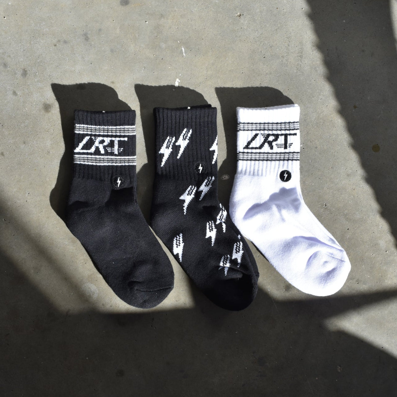 Kid's Classic Rock sock collection featuring LRT spark logo, showcasing premium cotton blend and cushioned comfort. Three-pack displayed to highlight vintage design details.