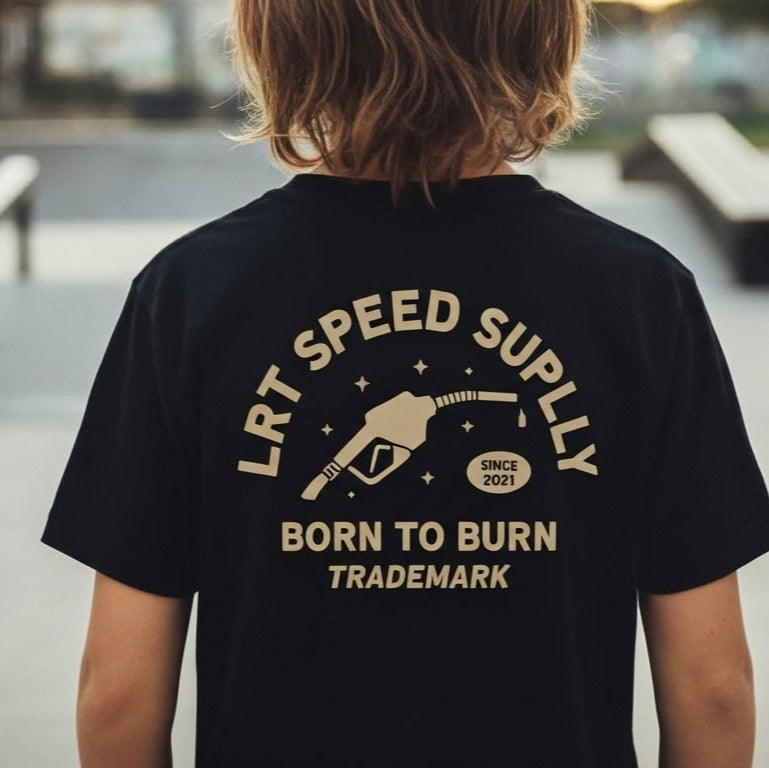 Person wearing a black t-shirt with text at a skate park