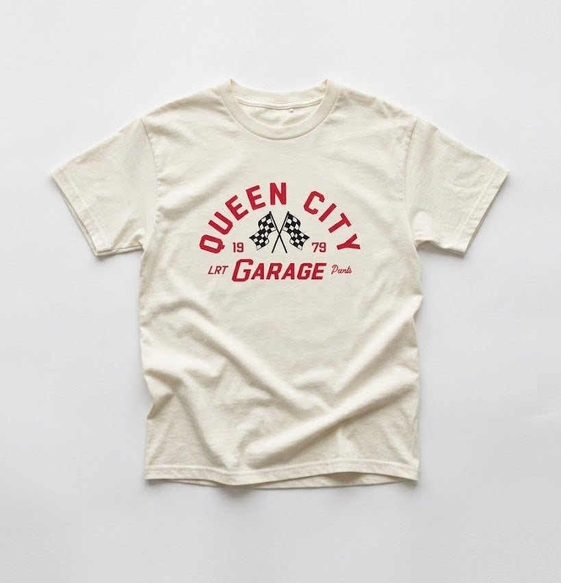 White t-shirt with red and black graphic design on a white background